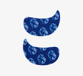 Brightening undereye patches from Topicals in a blue astronaut-print hydrogel design, shown as a left and right pair on a white background.